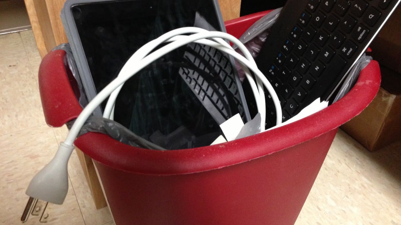 Assorted technology in a trash can